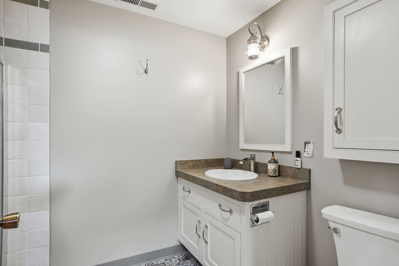 Clean bathroom vanity with modern fixtures and ample counter space.