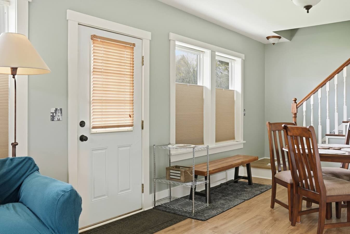 elcoming entryway with convenient seating and natural light.