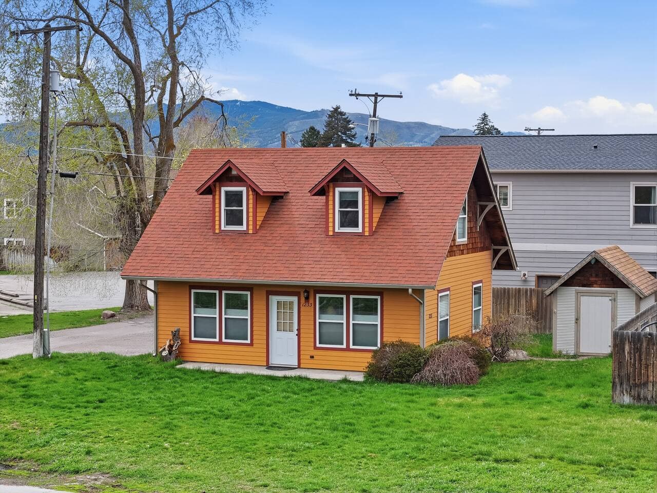 Charming cottage exterior with inviting curb appeal.