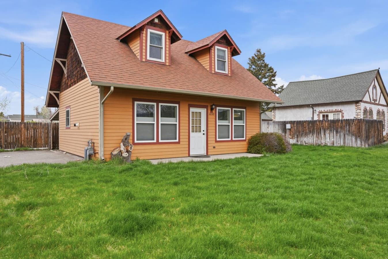 Warm inviting exterior with classic cottage character.