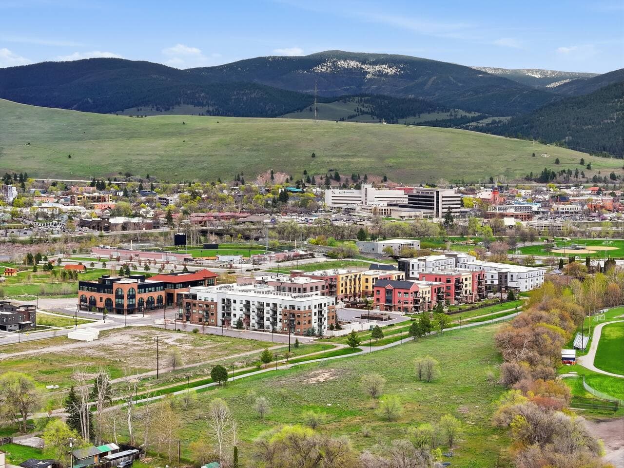 Scenic city and mountain views highlight the beautiful surrounding area.