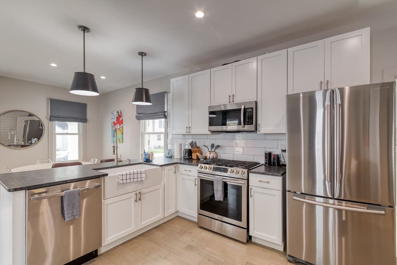Fully equipped kitchen with stainless steel appliances and modern finishes.