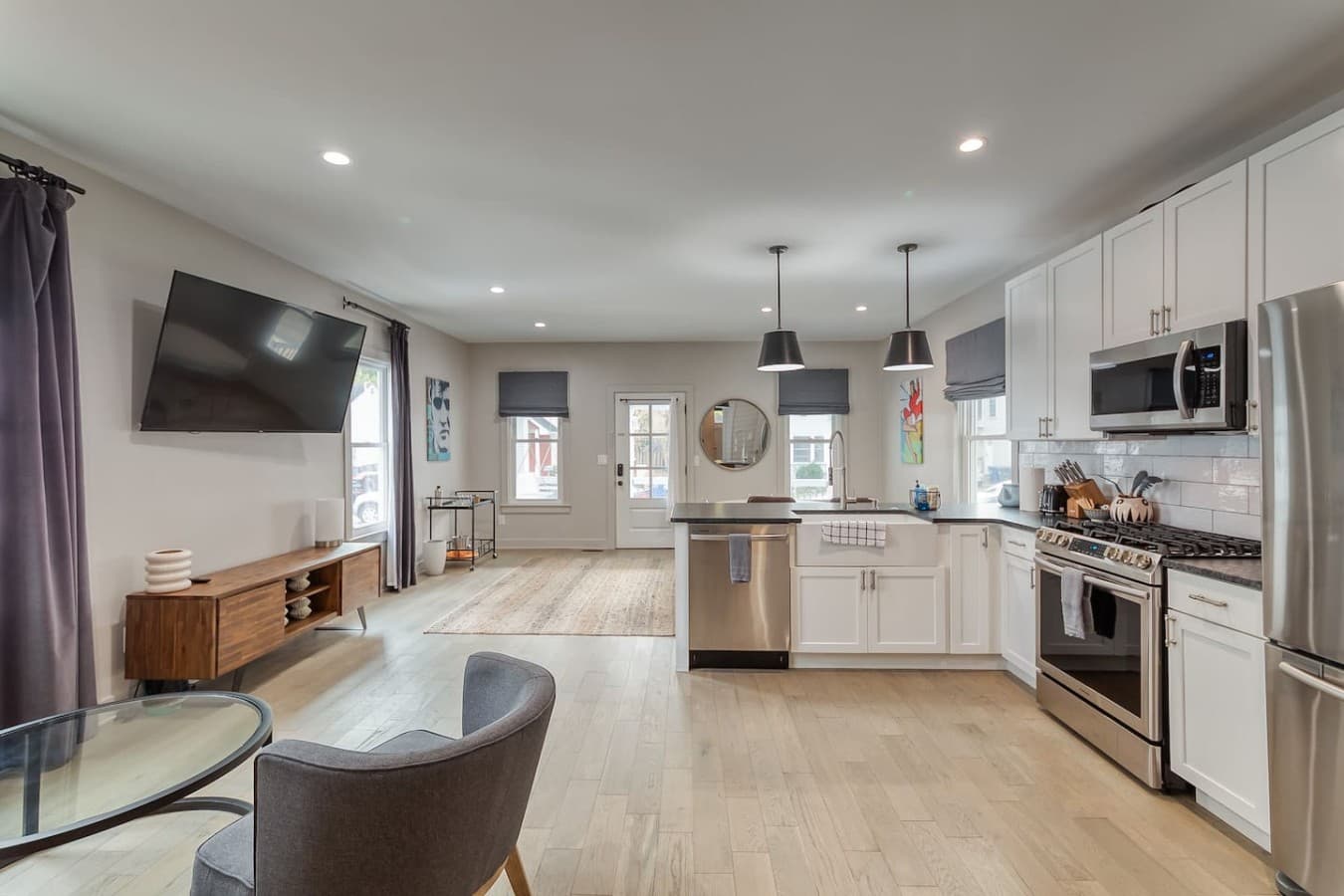 Open living and kitchen space designed for gathering and entertaining.