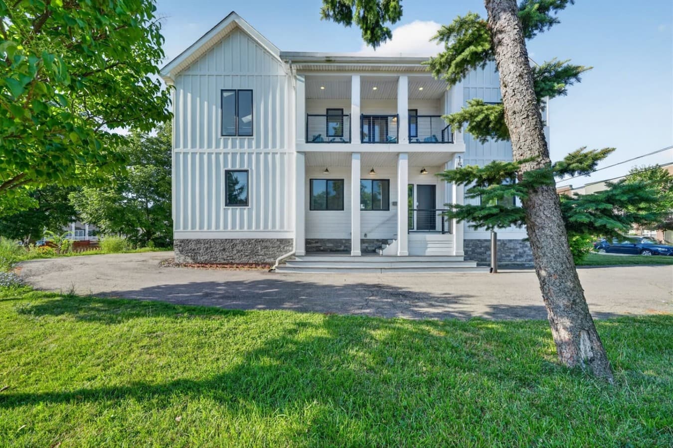 Inviting front entrance with covered porches perfect for relaxing outdoors.