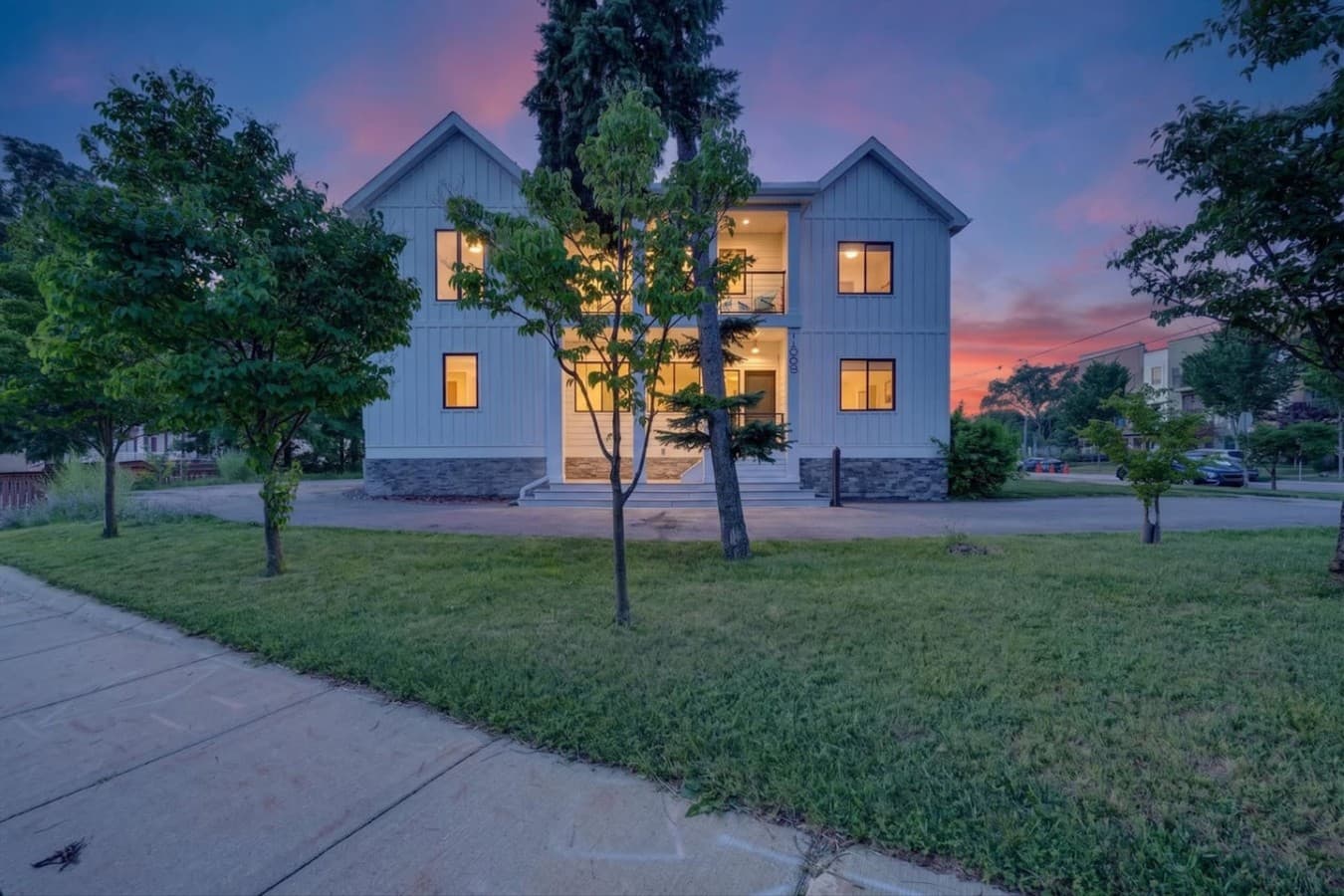 Welcome to your modern Ann Arbor retreat, beautifully illuminated at sunset.