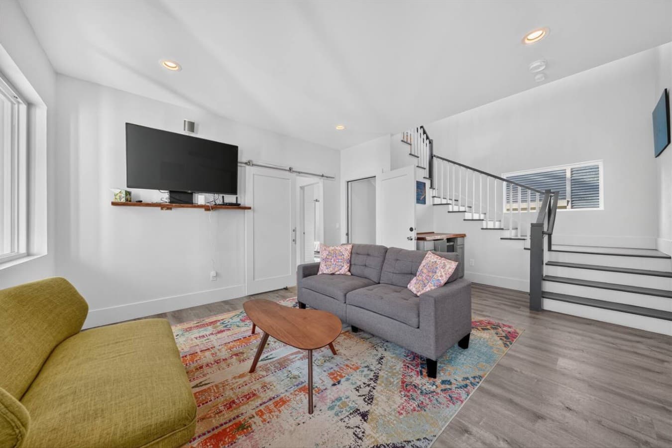 Relax with family or friends in the cozy lounge featuring a Smart TV and comfortable seating.