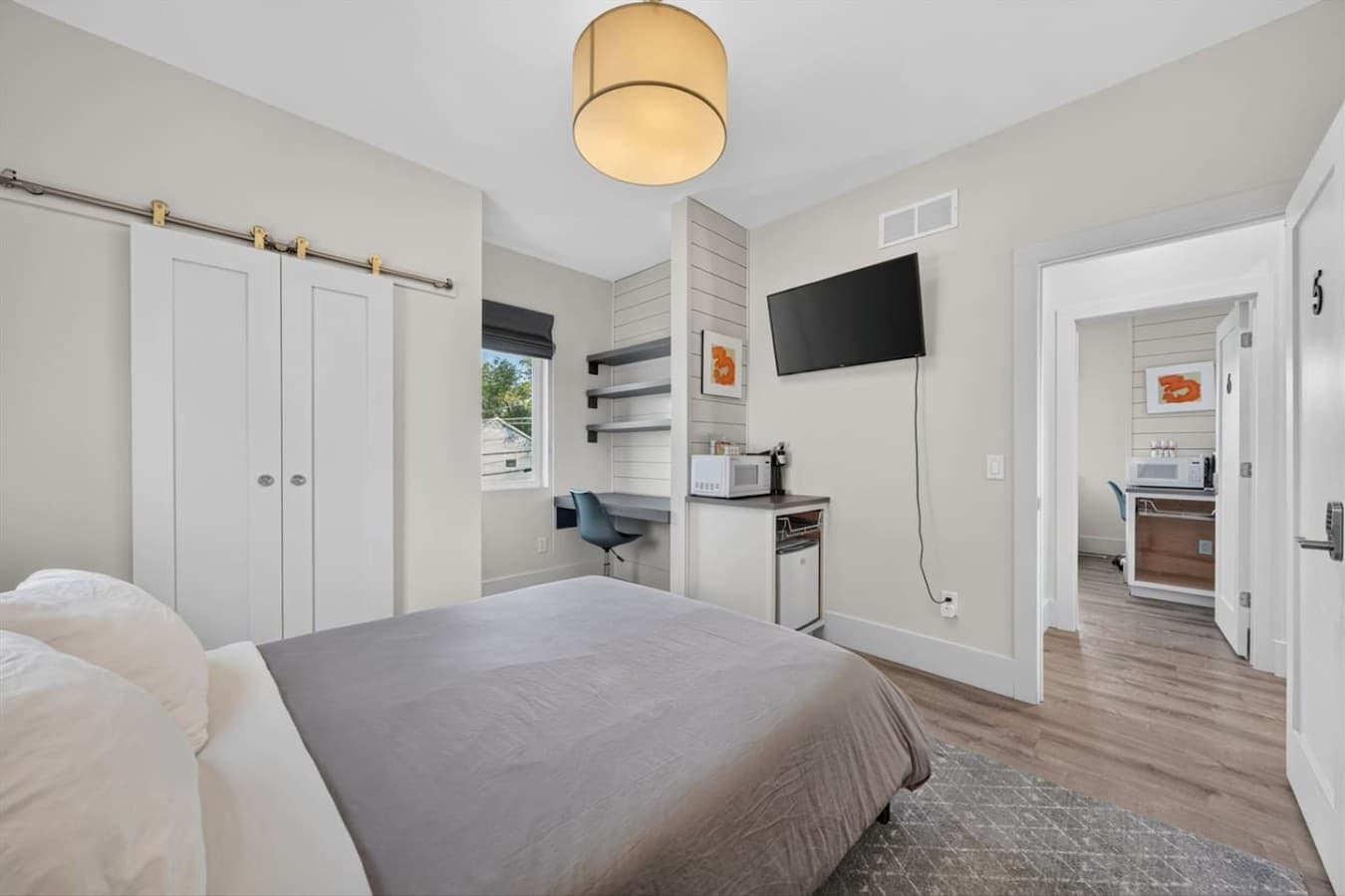 Rest easy and stay productive with a comfortable bedroom that also provides space for remote work or study.