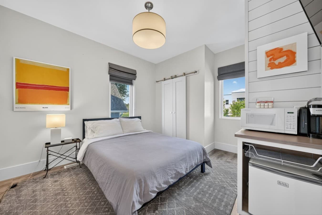 Enjoy the privacy of the spacious primary suite with a comfortable bed.