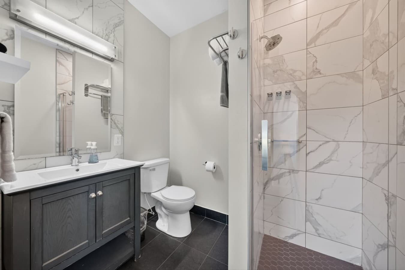 Full bathroom stocked with fresh towels and essential amenities.
