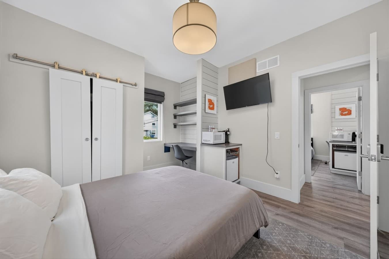 Wake up refreshed in this bright and spacious primary bedroom featuring premium linens, thoughtful décor, and plenty of room to unwind.