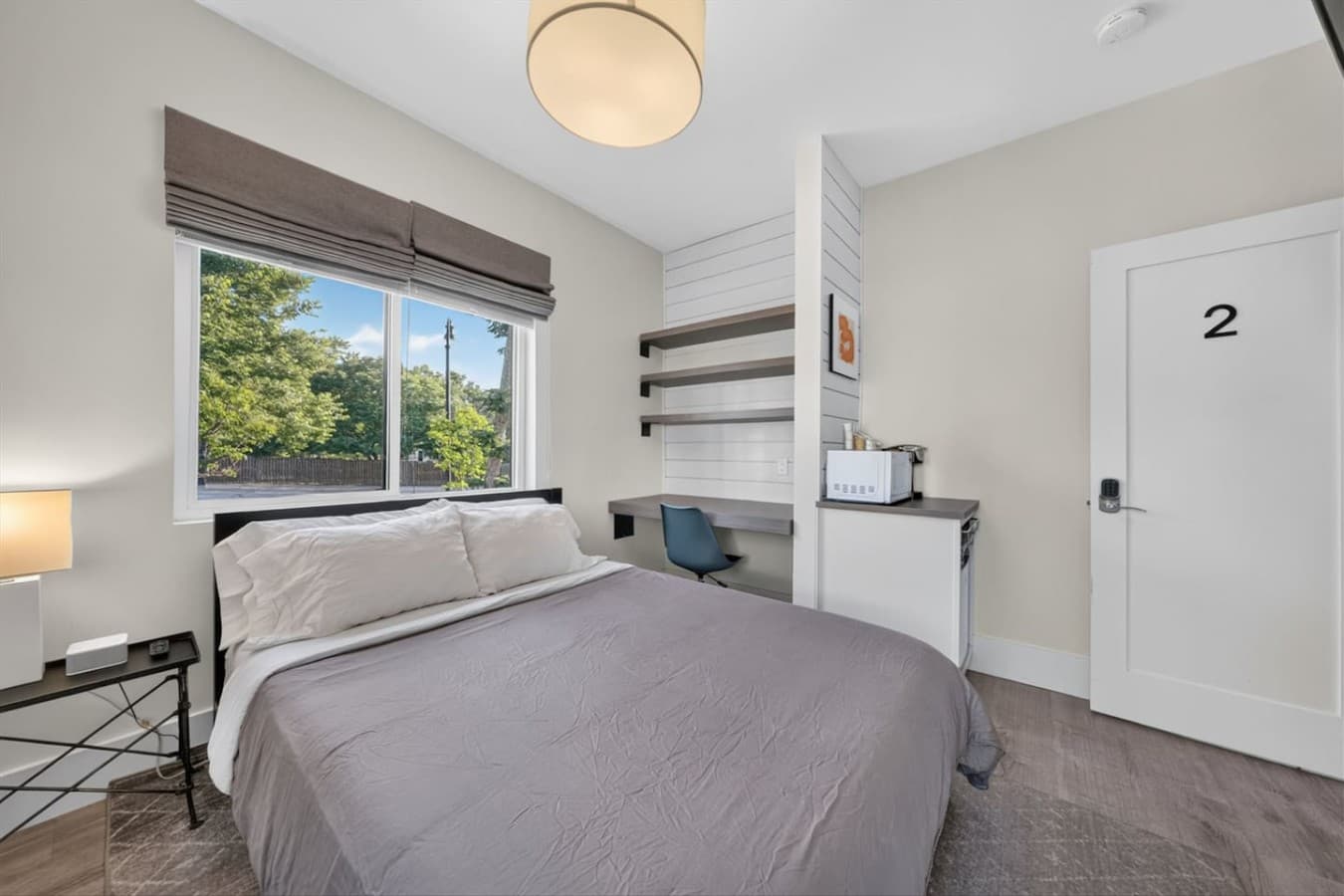Comfort meets style in this inviting bedroom, perfect for couples, friends, or family after a day exploring Ann Arbor.