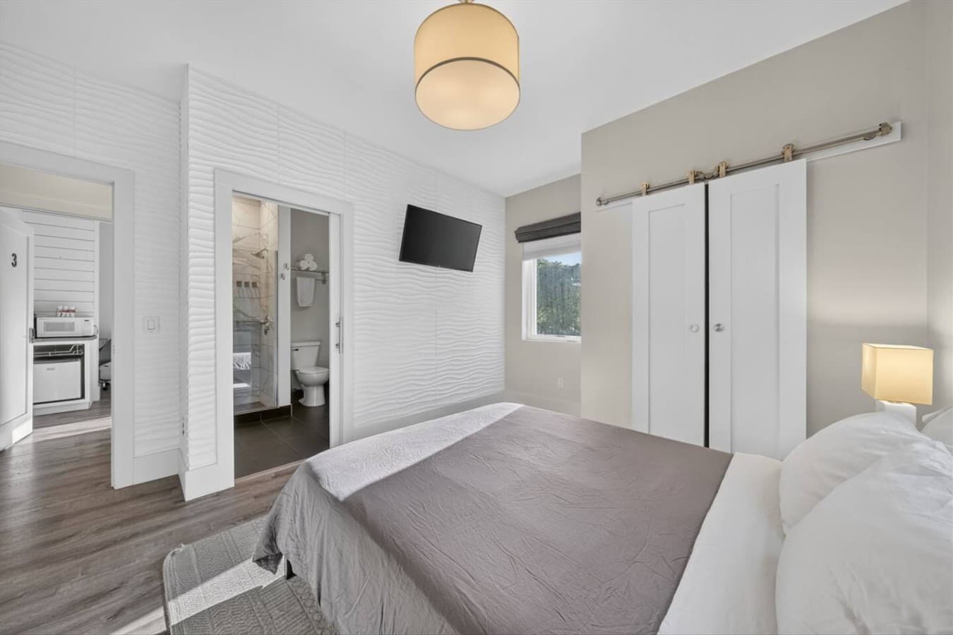 Designed with comfort in mind, this welcoming bedroom provides a peaceful place to rest after a busy day.