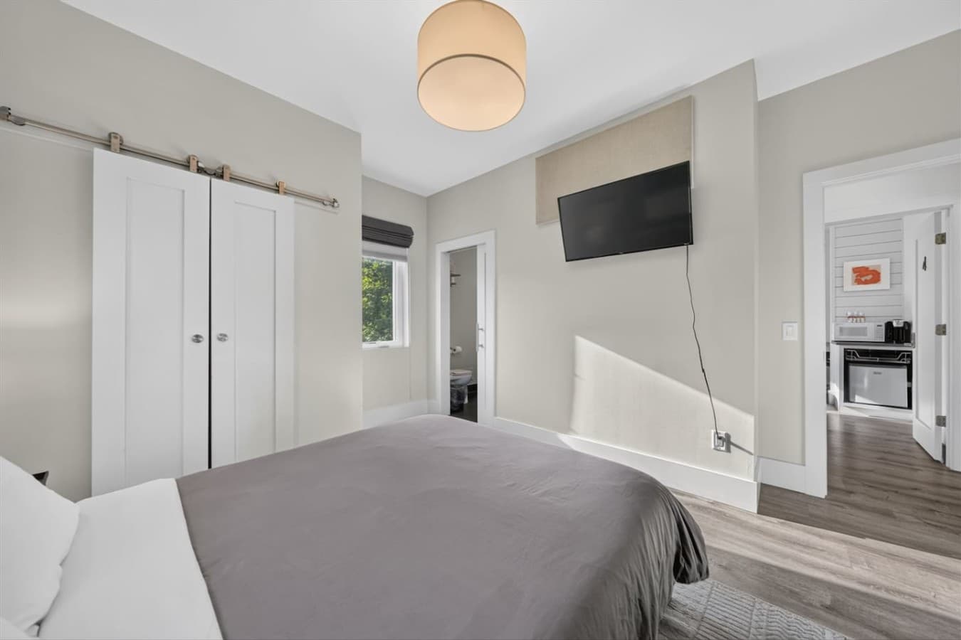 Queen size bed thoughtfully prepared with fresh linens.