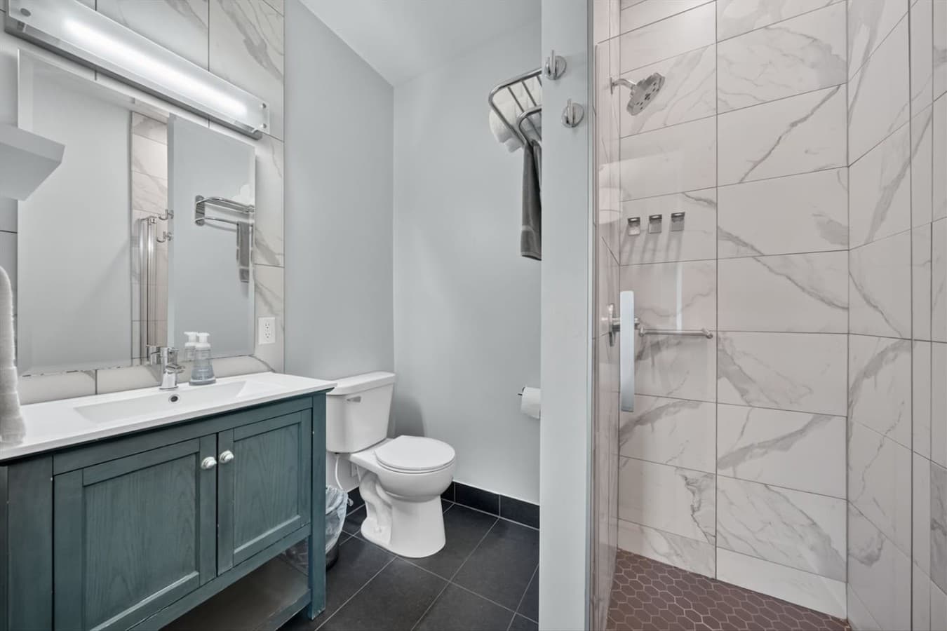 Well-appointed full bathroom with a shower and fresh towels.