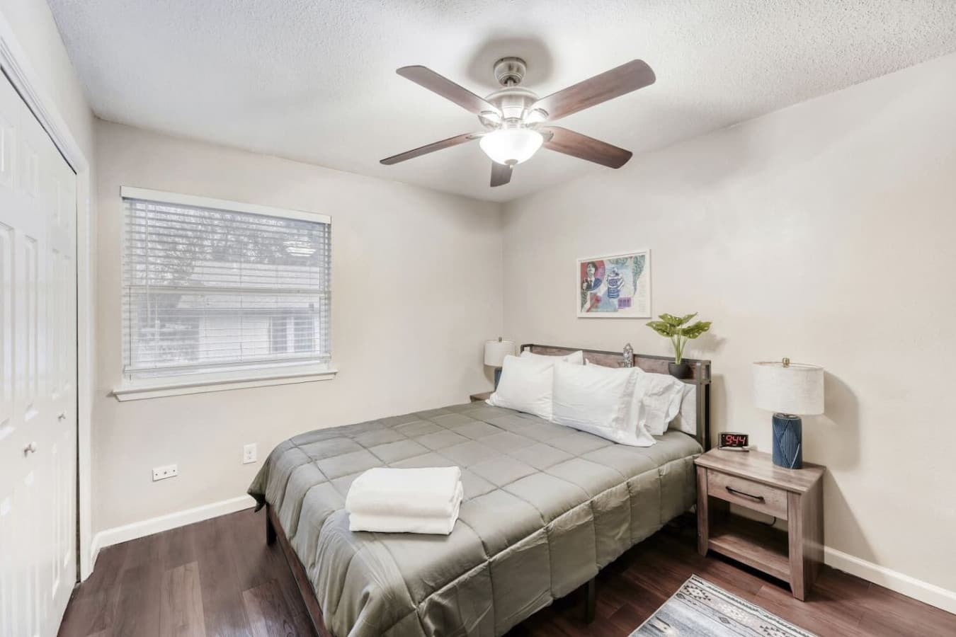 Bedroom with nightstands and natural light.