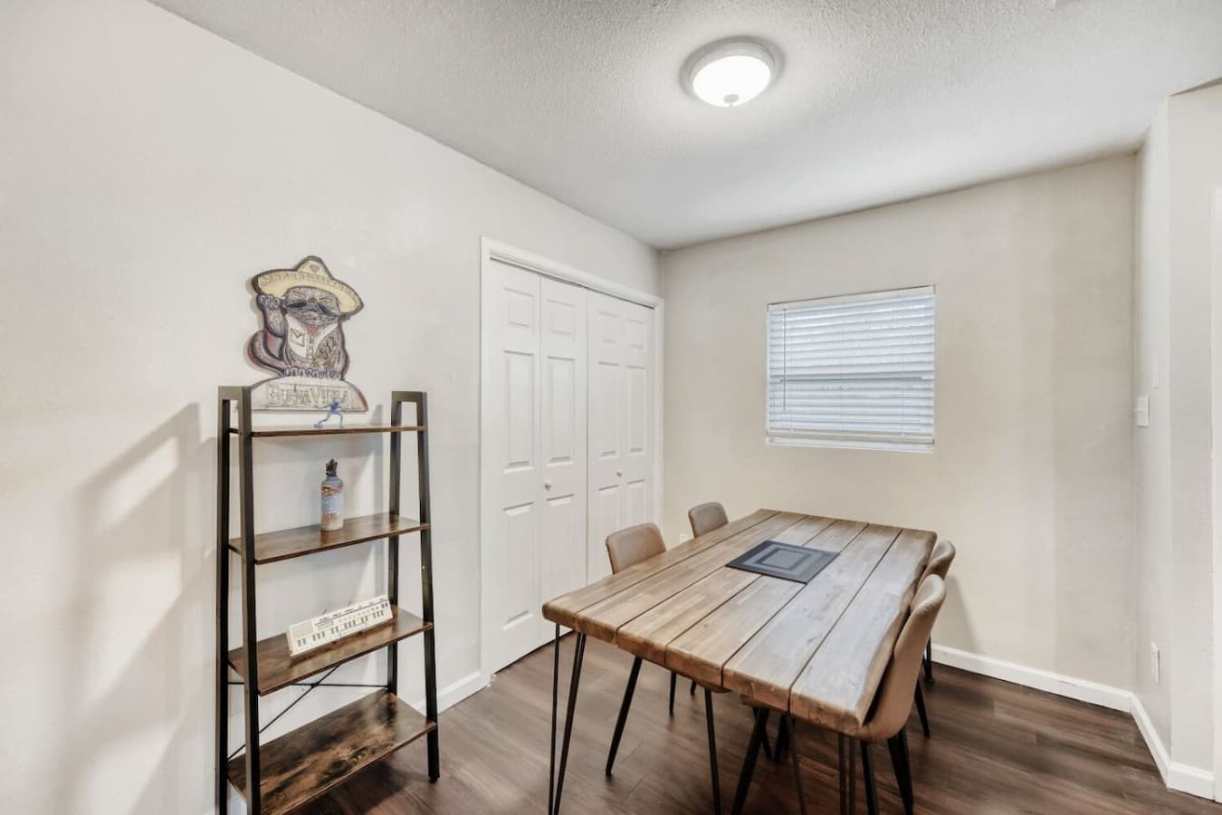 Dining space with storage shelving.