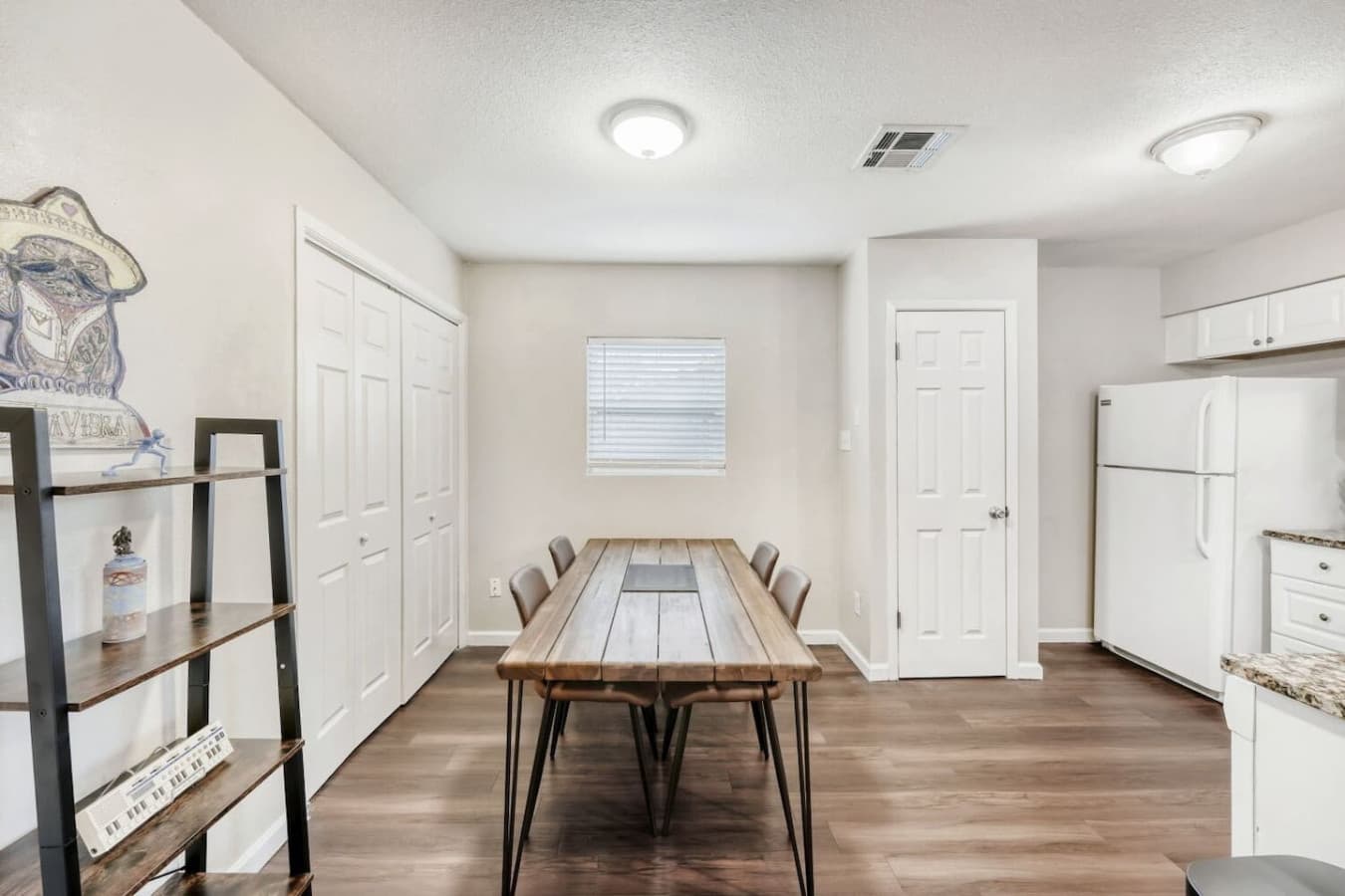 Dining table with seating for meals or work.
