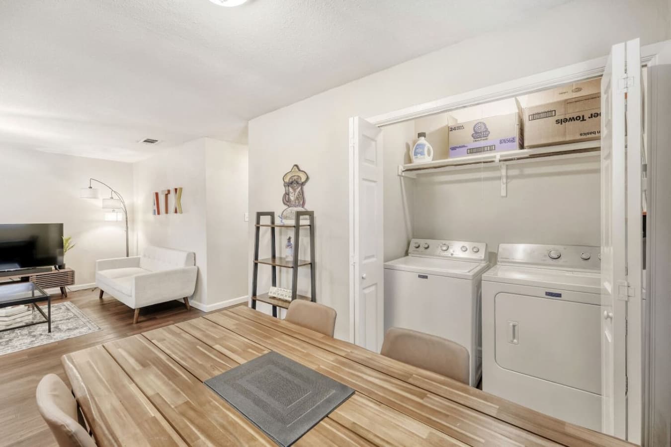 In-unit laundry area with washer and dryer.