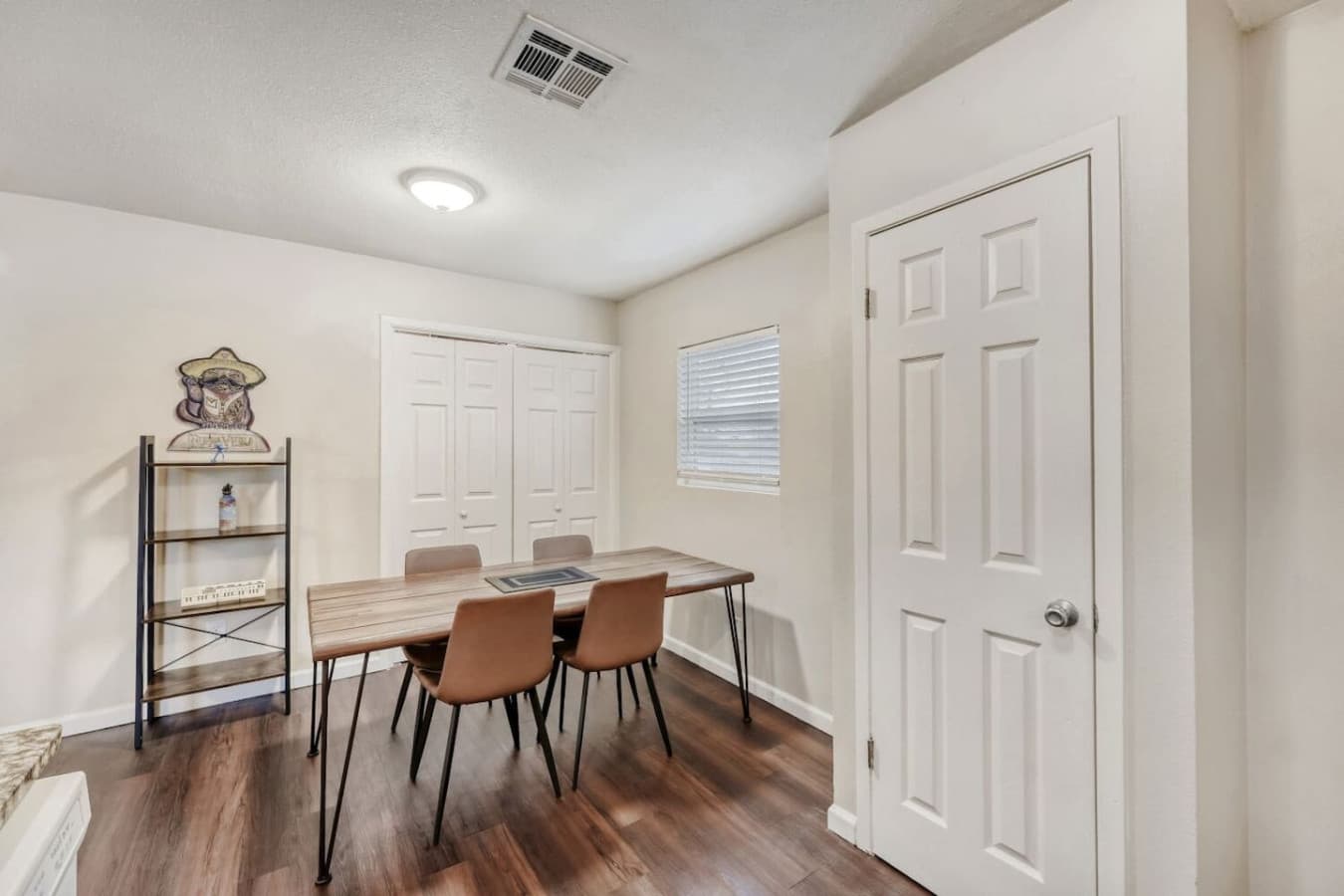Dining area with table and seating.