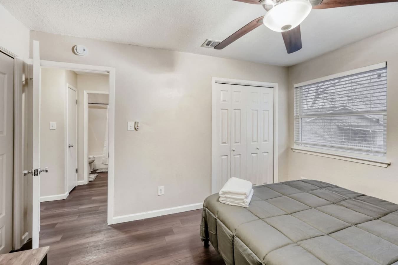 Bedroom with closet and hallway access.