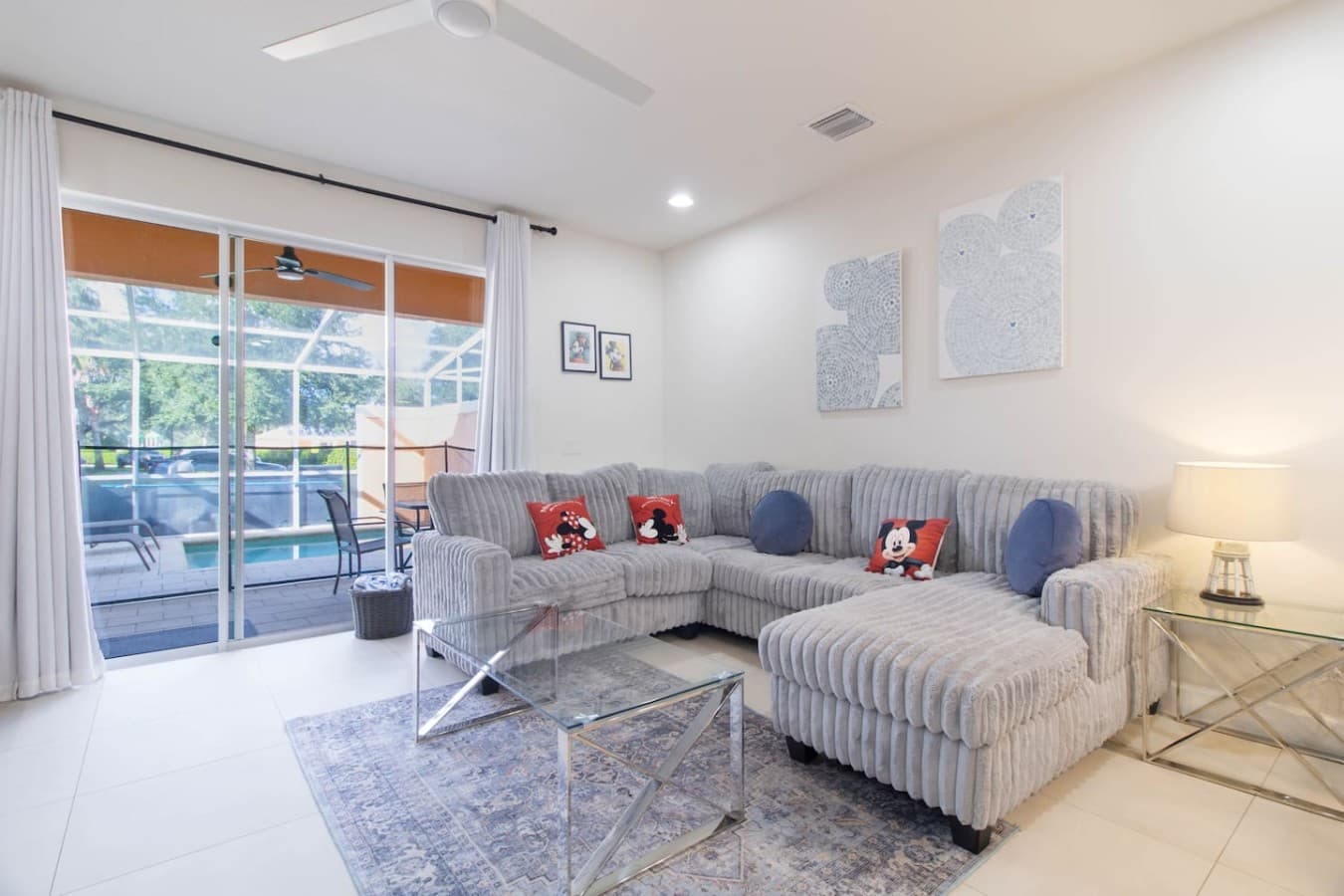 Bright and inviting living room with a spacious sectional sofa and abundant natural light.