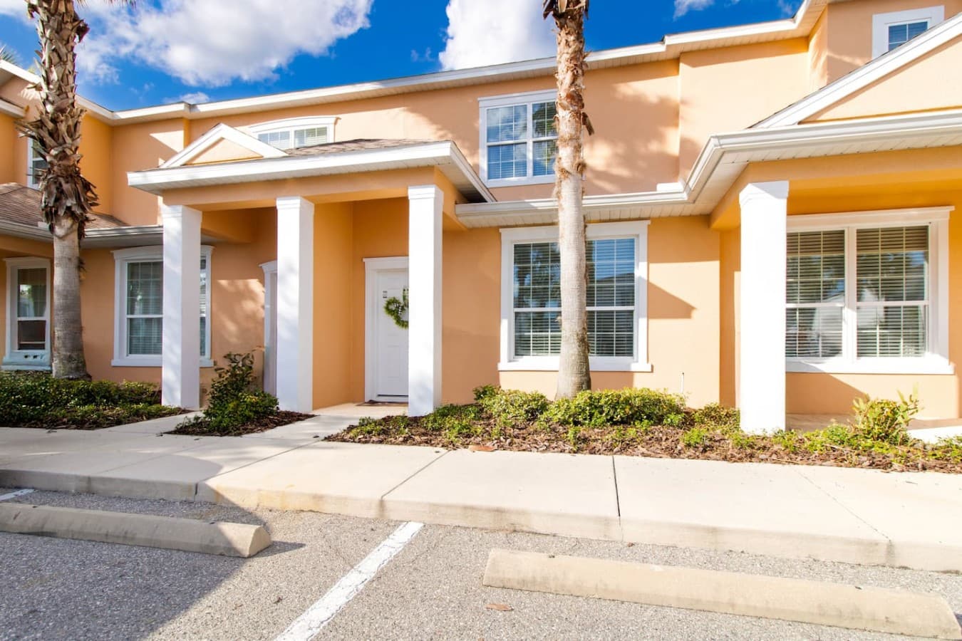 Beautiful townhouse exterior with attractive curb appeal and convenient parking nearby.