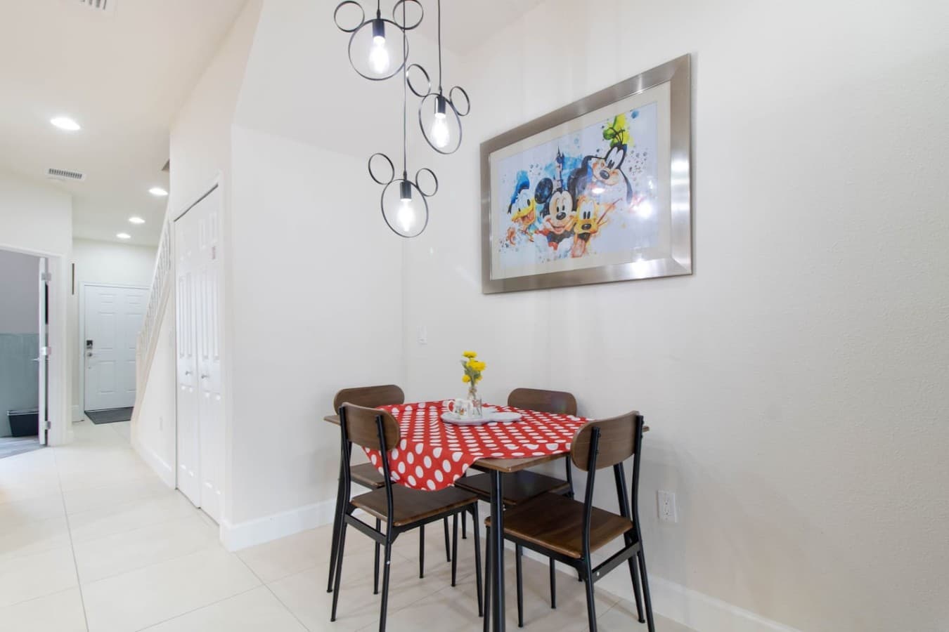Cozy dining nook with stylish lighting and contemporary decor.