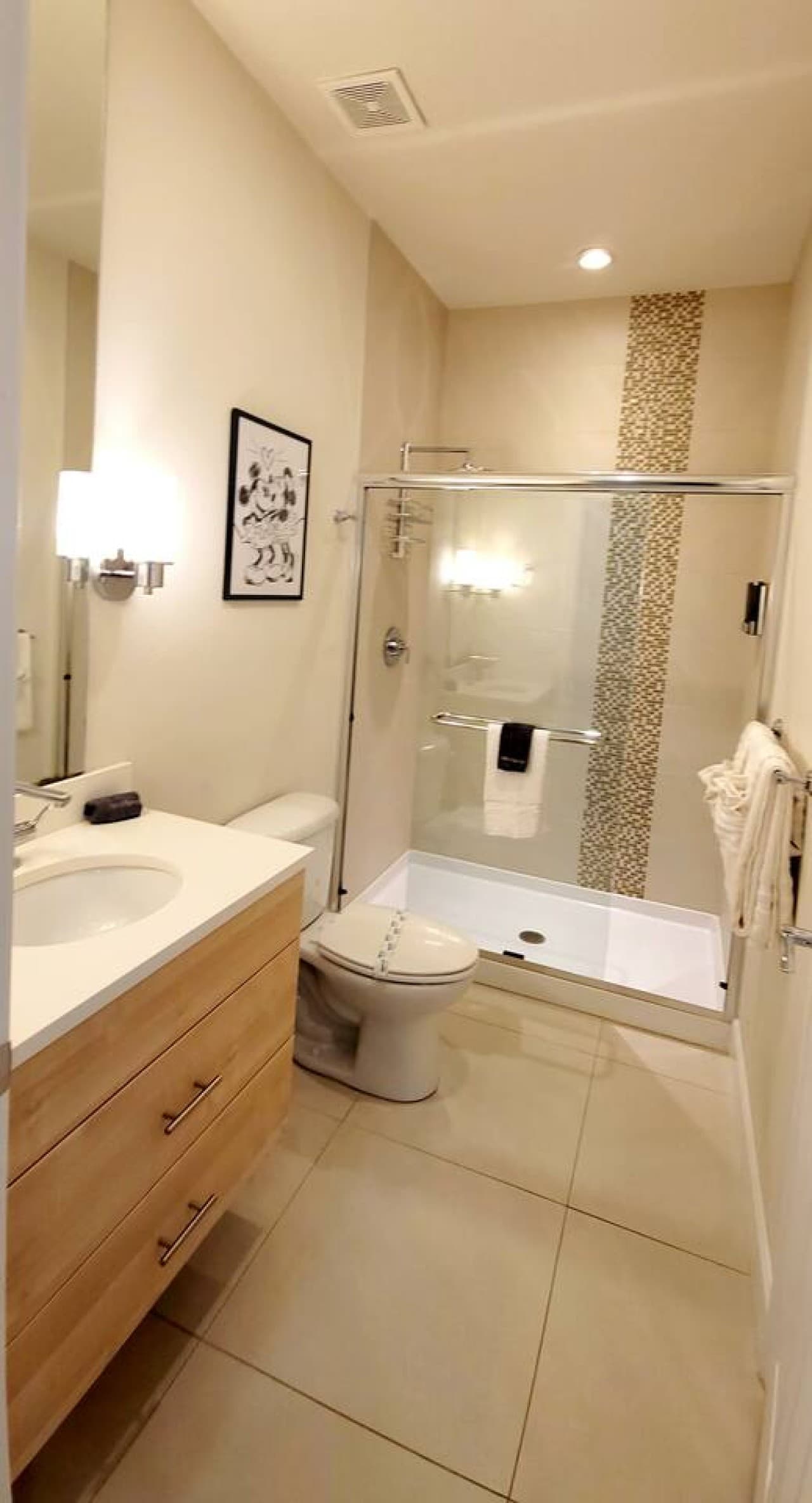 Modern bathroom featuring a glass enclosed walk in shower and contemporary finishes.