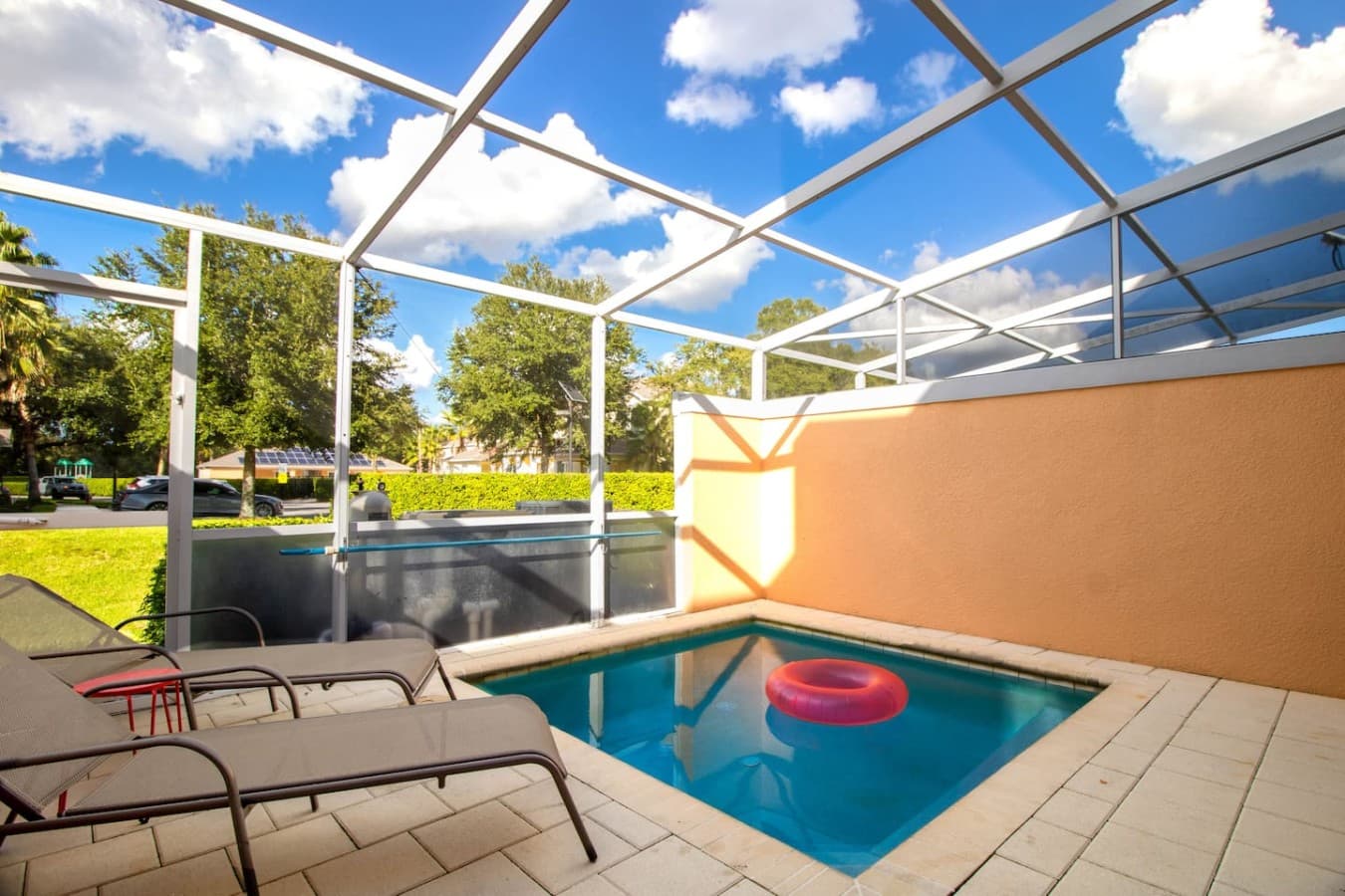 Refreshing private pool enclosure offering sunny lounging areas and tranquil outdoor views.