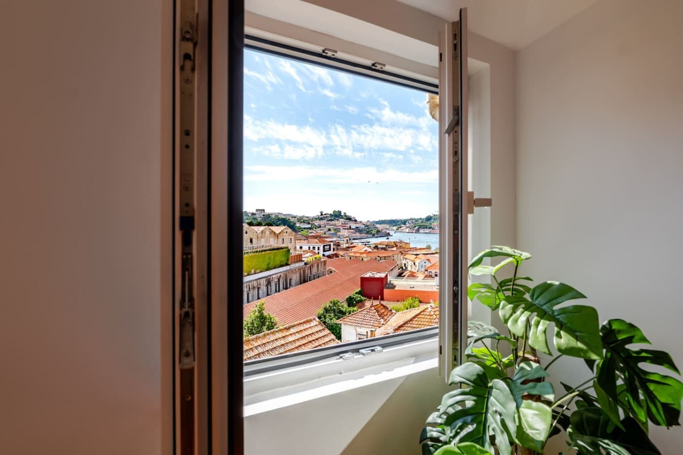 Large windows flood the living area with sunlight throughout the day.