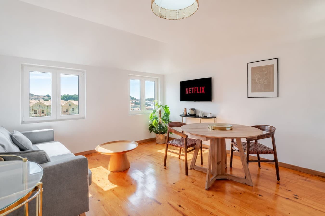 Enjoy a cozy lounge, dining table, and TV all in one welcoming space.