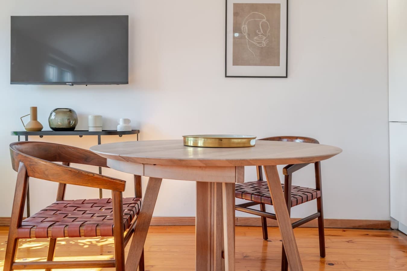 The sunlit living area offers the perfect spot to relax, watch TV, or enjoy your meal.