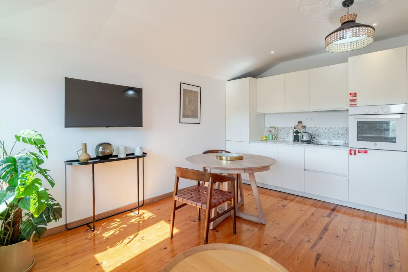 Enjoy a cozy lounge, dining table, and watch your favorite shows all in one welcoming space.