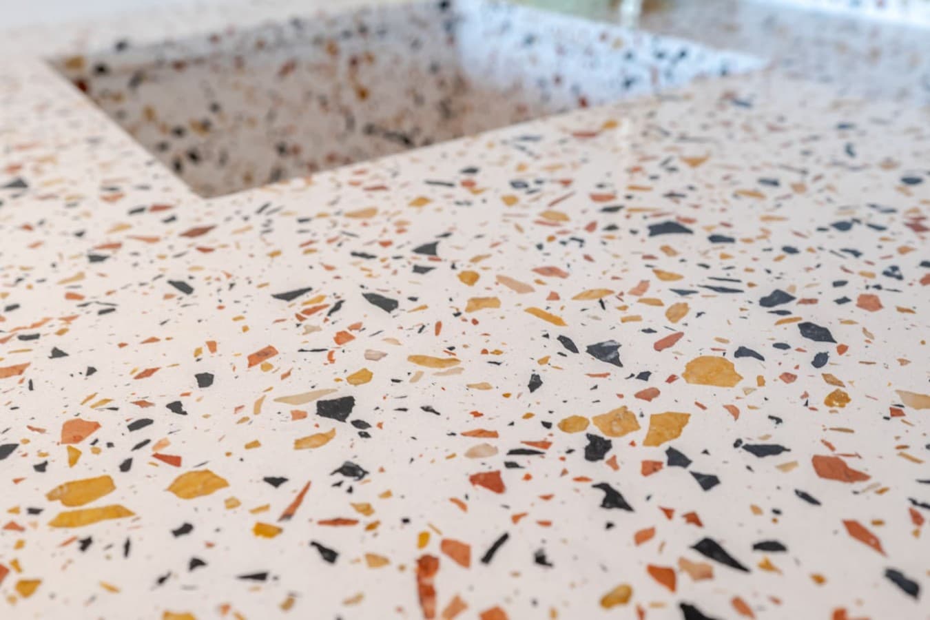 Stylish terrazzo finishes add a modern touch to the bathroom vanity.