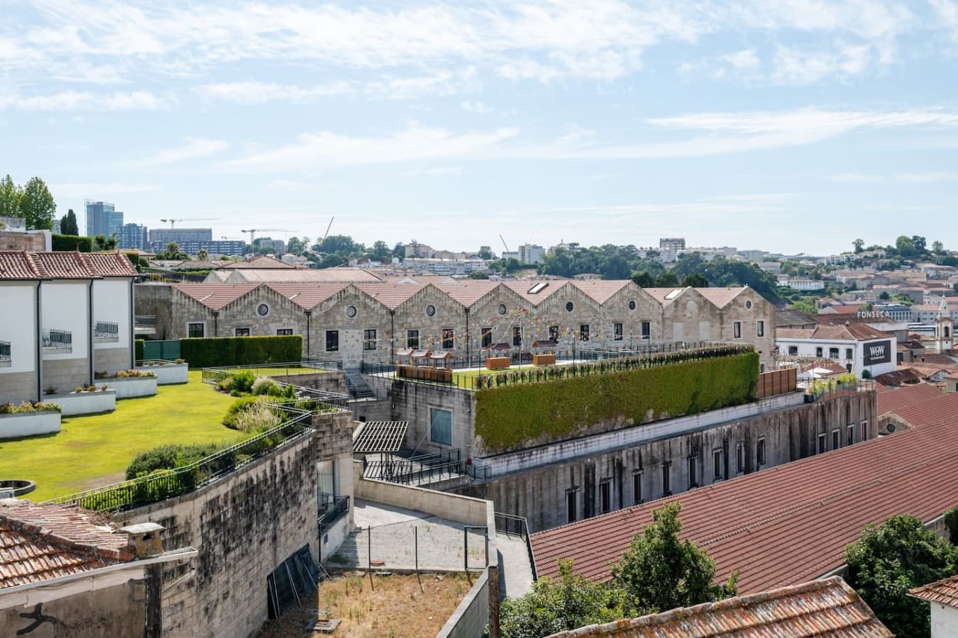 Elevated views showcasing the charm of historic rooftops, lush hillsides, and the sparkling river.