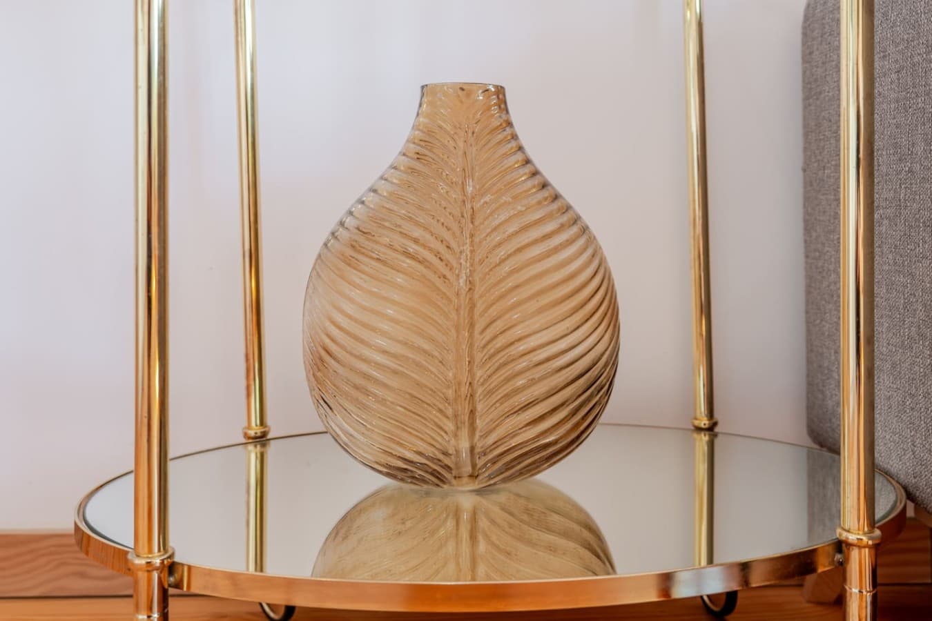 Elegant decorative glass vase displayed in the side table.