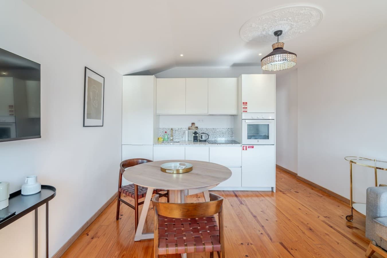 The open dining area flows seamlessly into the modern kitchen