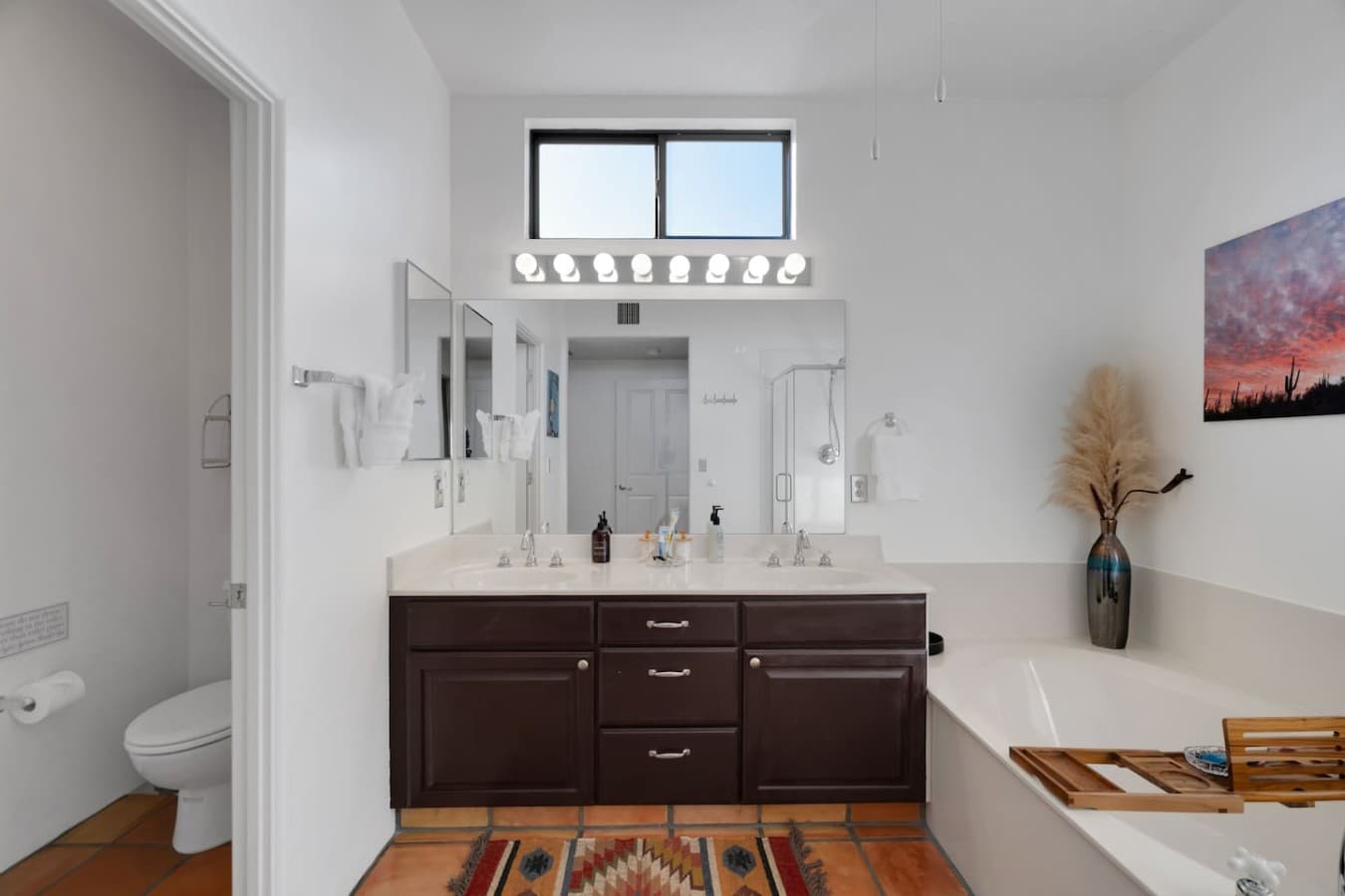 Bright bathroom with double vanity and plenty of counter space.