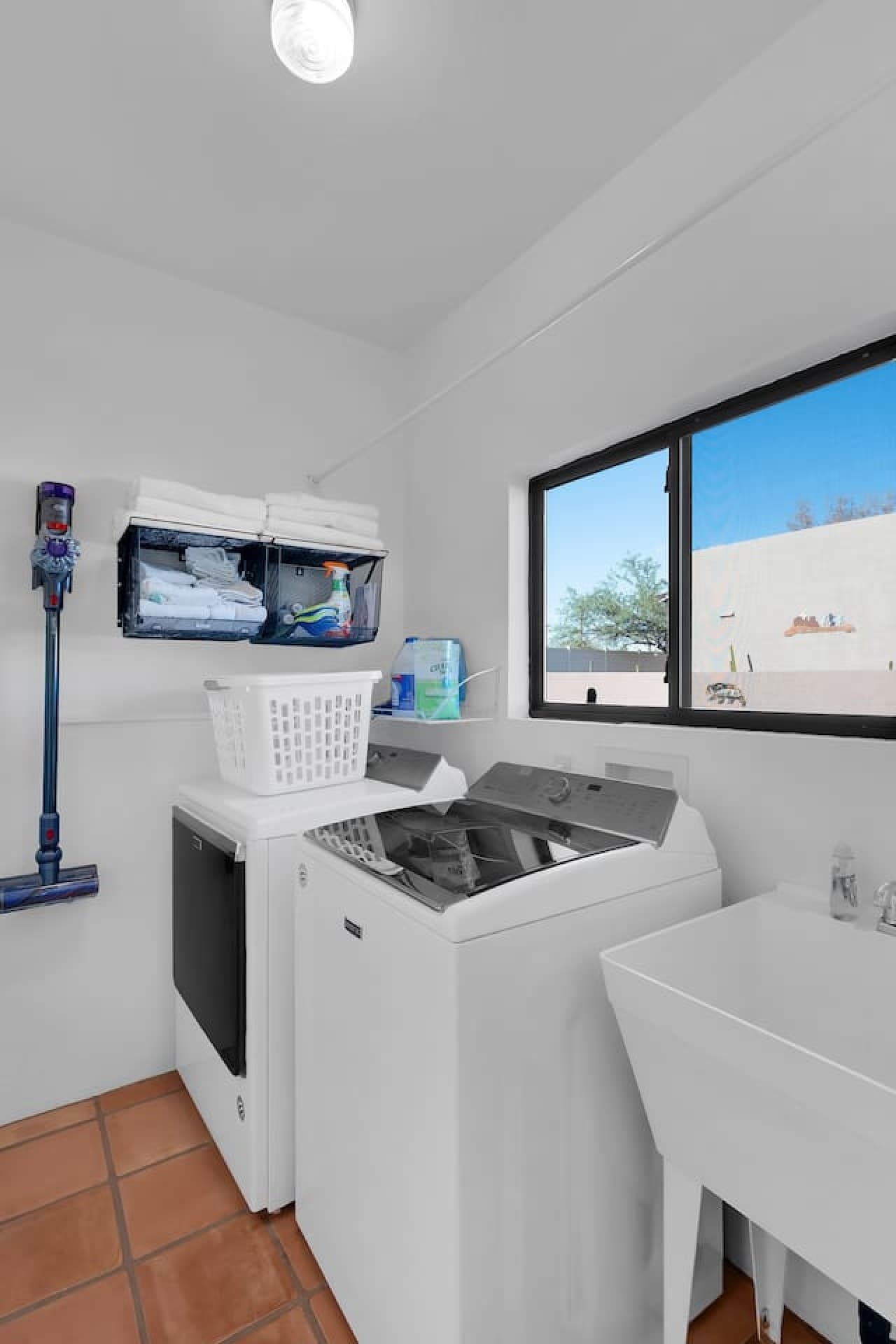 Laundry area with washer dryer and convenient workspace.
