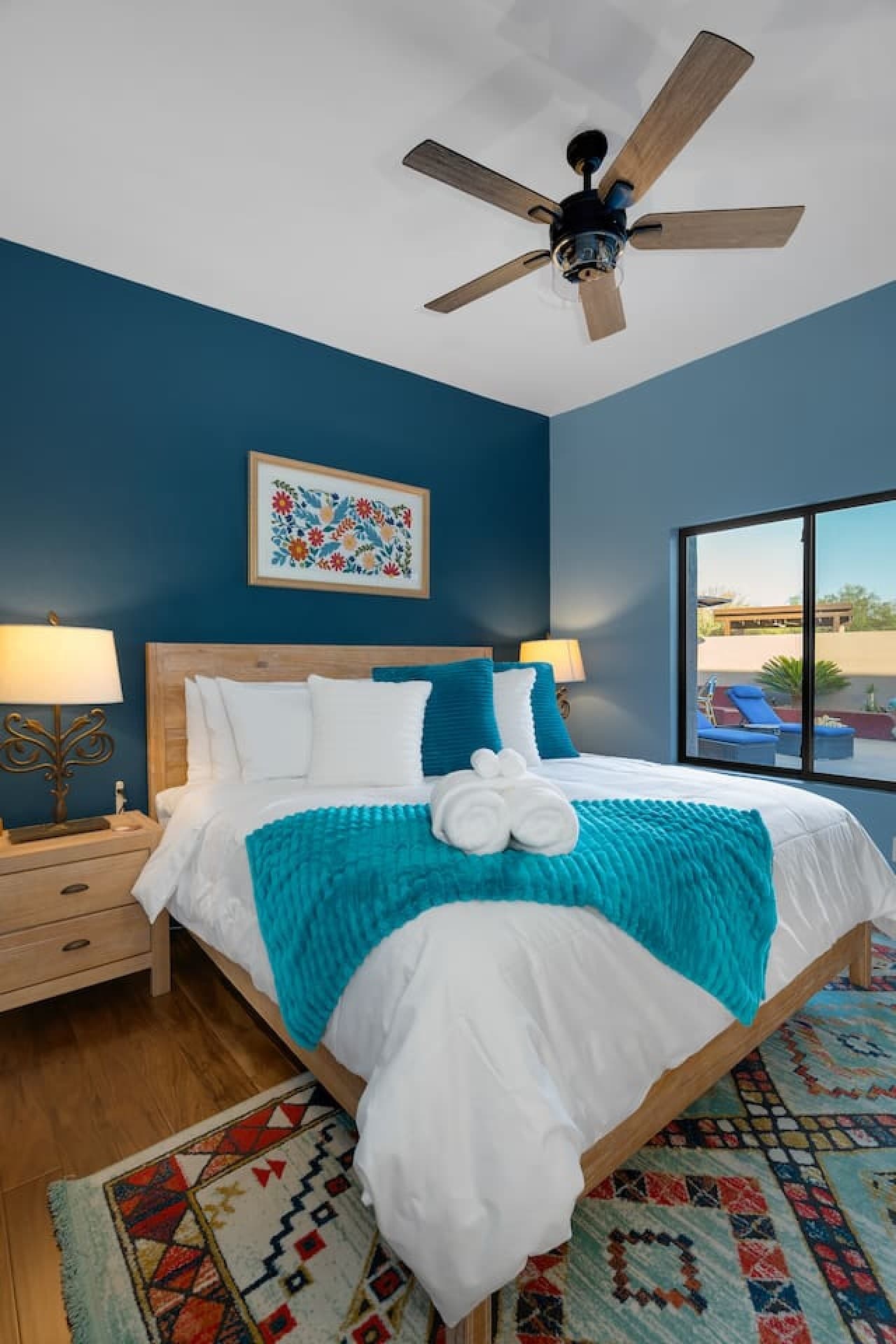Cozy bedroom with soft linens and calming blue tones.