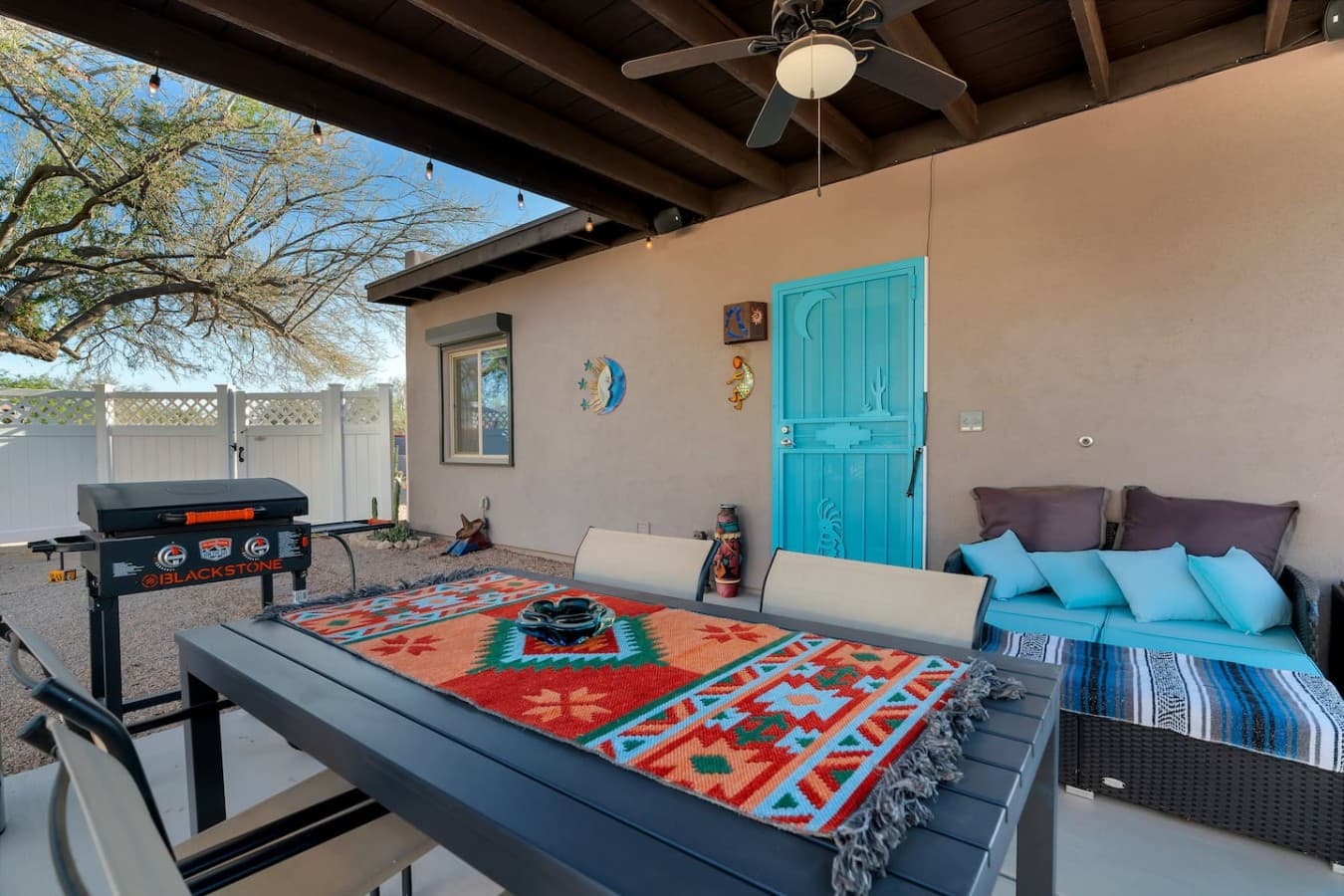 Moon Dance Casita; Private covered patio with colorful accents and comfortable outdoor seating.