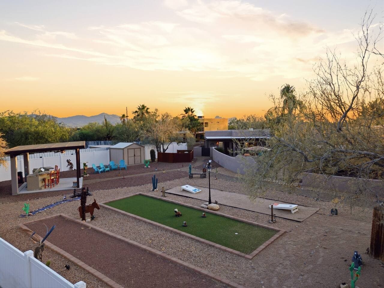 Large yard with games and open space for gatherings.