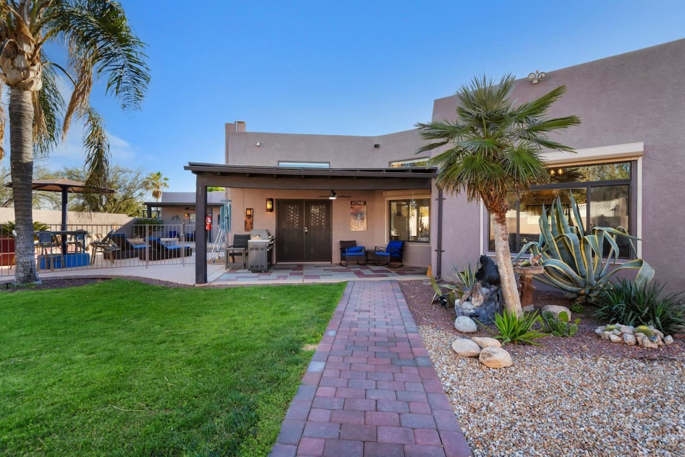 Beautiful backyard with landscaped lawn and inviting outdoor living spaces.