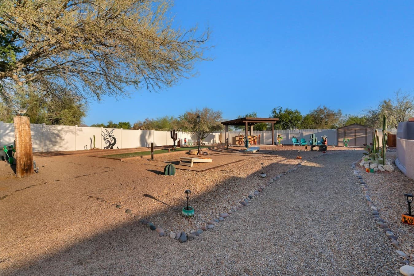 Large backyard with multiple areas to gather and unwind.