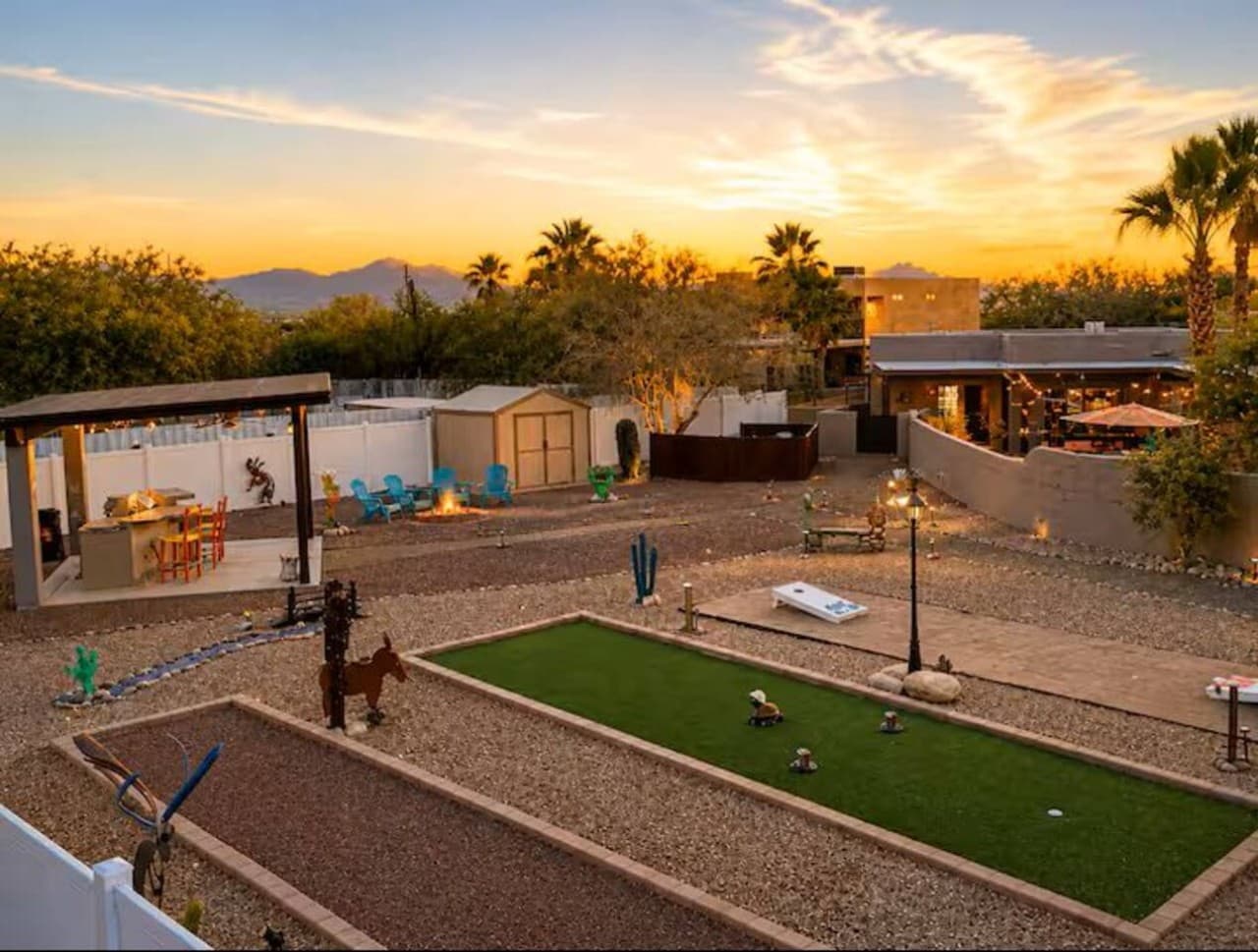 Large yard with games and open space for gatherings.