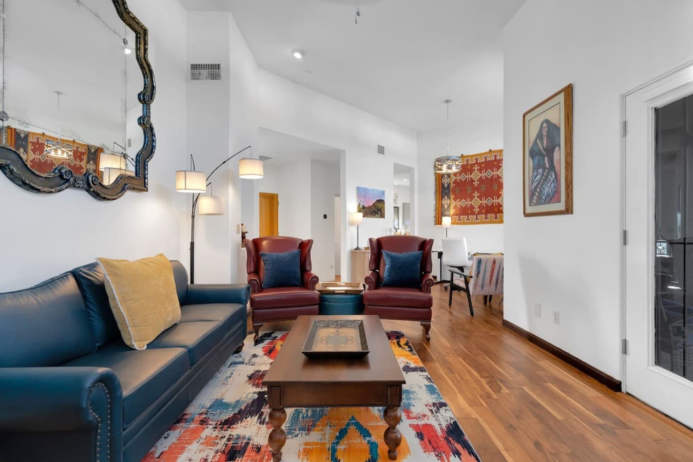 Bright and airy living space with stylish seating and warm wood floors.