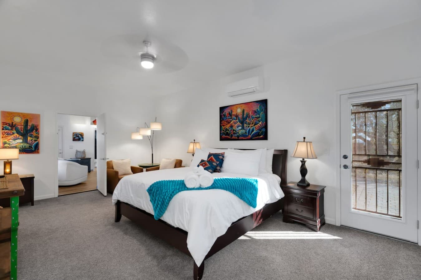 Comfortable bedroom with plush bedding and plenty of natural light.