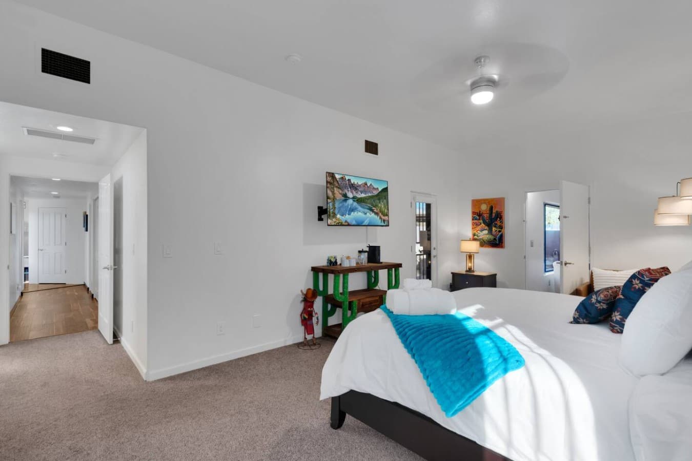 Spacious bedroom with simple design and room to relax.