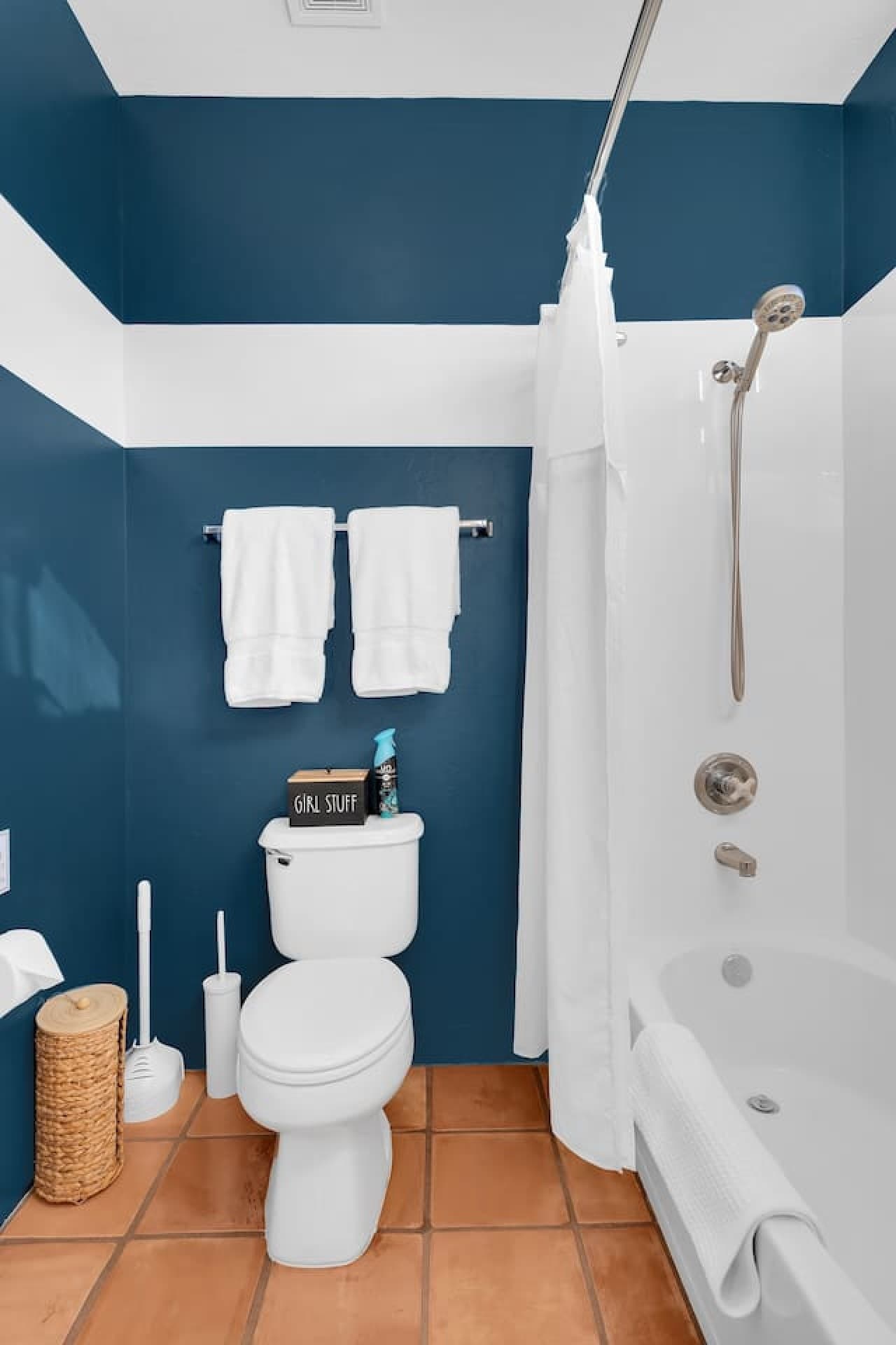 Clean bathroom with shower and fresh, modern finishes.