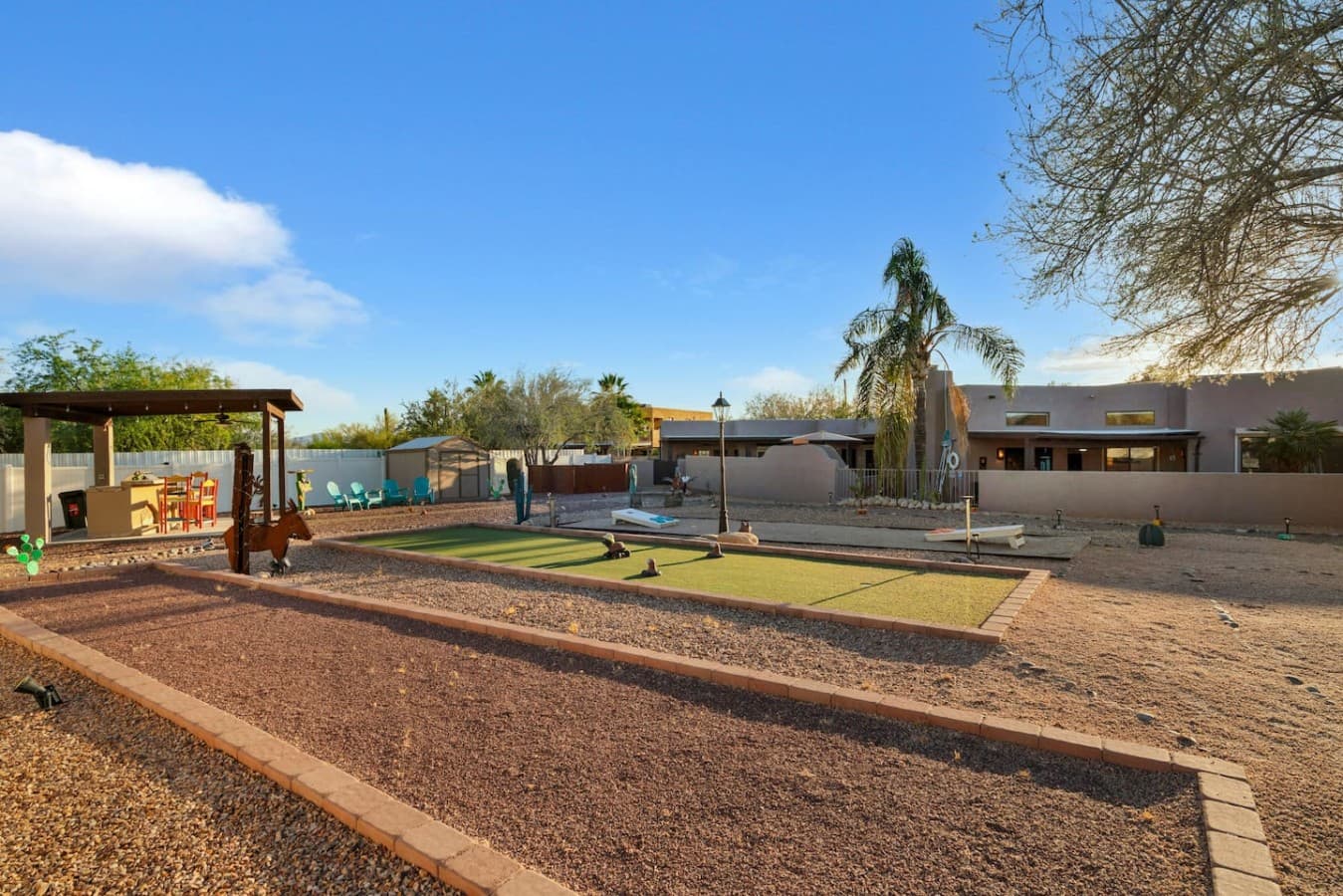 Expansive backyard with turf area and space for outdoor activities.